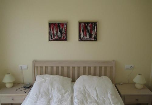A bed or beds in a room at Casa de Sonrisa