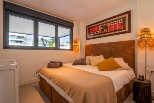 Ένα ή περισσότερα κρεβάτια σε δωμάτιο στο Apartment in Estepona Ojala Casa Oasis325