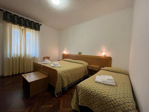Postel nebo postele na pokoji v ubytování Hotel La Torretta