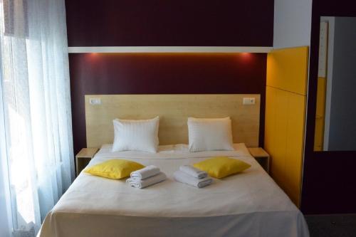 Postel nebo postele na pokoji v ubytování Alba Hotel