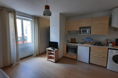 a kitchen with a sink and a dishwasher at Chez Simon et Loreline Yerres proche Paris Orly Disney in Yerres