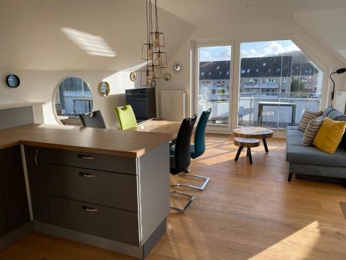 Photo de la galerie de l'établissement BEACH HOUSE II - Penthousewohnung in Bestlage mit sonniger Dachterrasse und top Meerblick, à Harrislee