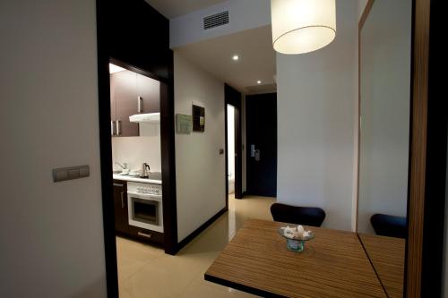 En eller flere senger på et rom på Aparthotel Attica21 As Galeras