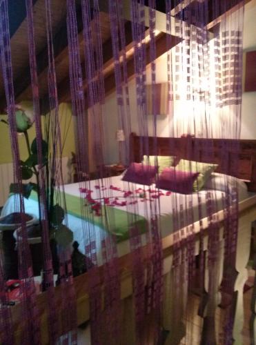 a living room with a table and a window at La Fuente in Umbrías