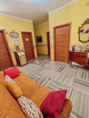 a large room with a bed and a piano at Hotel Serenella in Turin