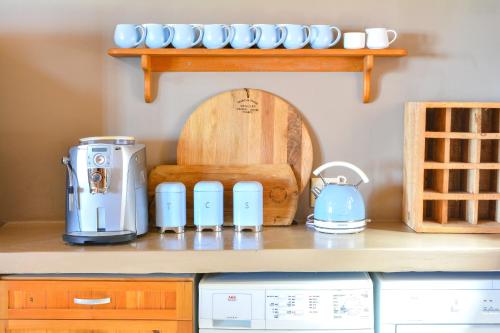 a kitchen with a counter with appliances on it at 4 Zwaan in Jeffreys Bay