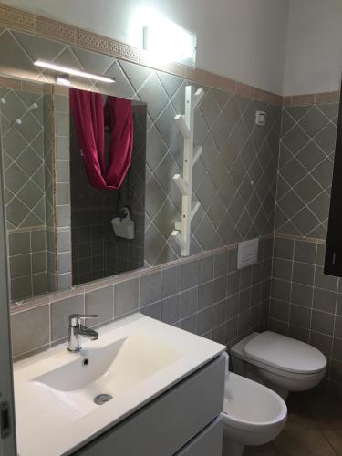 Ванна кімната в Casa Vacanze Porto Pino