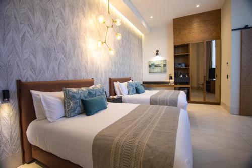 Postel nebo postele na pokoji v ubytování Becquer Hotel Guadalajara