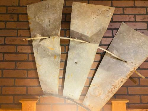 a metal sculpture in front of a brick wall at Deluxe Big Texan Multi Suite in Amarillo