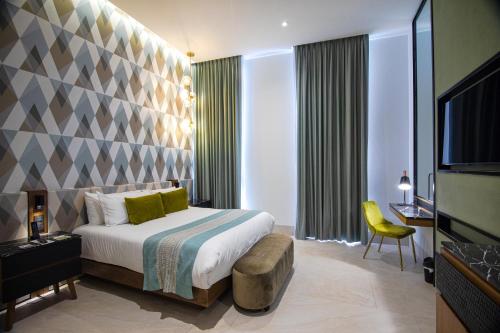 Becquer Hotel Guadalajaraにあるベッド