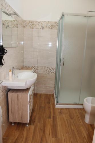 a bathroom with a sink and a shower at Agriturismo Karrares in Melendugno