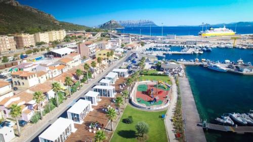 an aerial view of a harbor with boats in the water at Locanda Nina e lu Entu di Supra in Marina di Portisco