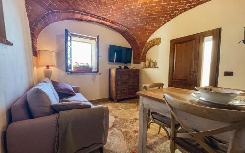 a living room with a couch and a table at La Torre in Torrita di Siena