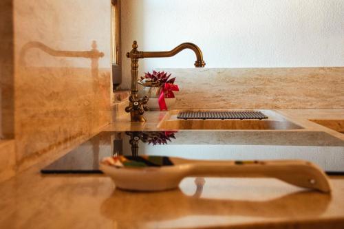 a kitchen counter with a sink next to a sink at La Torre in Torrita di Siena