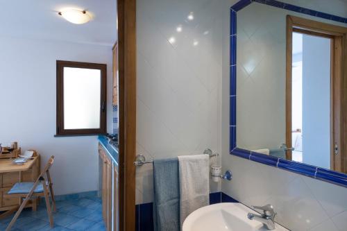 a bathroom with a sink and a mirror at Emotion in Praiano