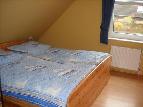 Postel nebo postele na pokoji v ubytování Ferienwohnung Wattwurm Dangast