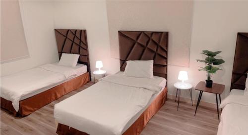 Кровать или кровати в номере Sunset Alula Villa- العلا