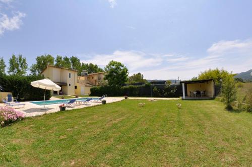 a large yard with a pool and a house at Corfu Villa Ermioli with Pool in Giannádes