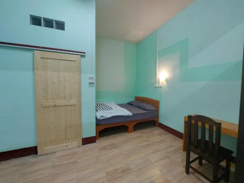 Postel nebo postele na pokoji v ubytování JaiSabai Homestay