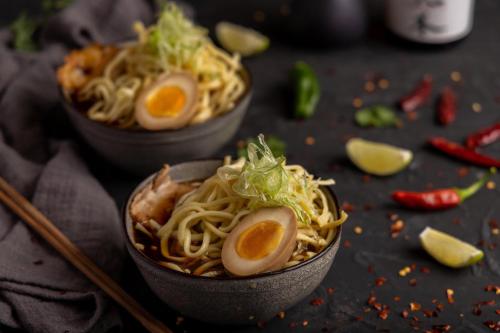 two bowls of noodles with eggs on a table at Moon Palace The Grand Cancun All Inclusive in Cancún
