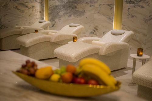 a bowl of fruit on a counter in a bathroom at Moon Palace The Grand Cancun All Inclusive in Cancún