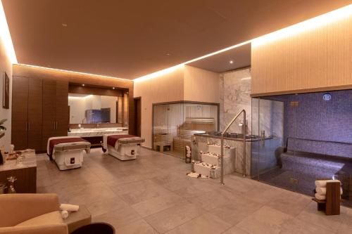 a large bathroom with a bunch of sinks and toilets at Moon Palace The Grand Cancun All Inclusive in Cancún