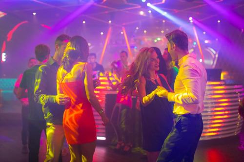a group of people dancing at a party at Moon Palace The Grand Cancun All Inclusive in Cancún