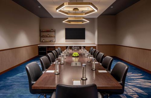 a conference room with a long table and chairs at Hyatt House Tampa Downtown in Tampa