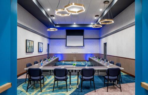 a conference room with a large table and chairs at Hyatt Place Tampa Downtown in Tampa