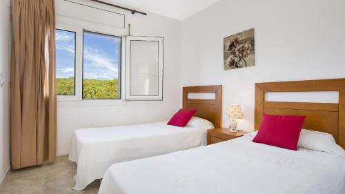 Postel nebo postele na pokoji v ubytování CB E-6 - Calella de Palafrugell