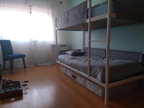 Двухъярусная кровать или двухъярусные кровати в номере Casa de Peniche