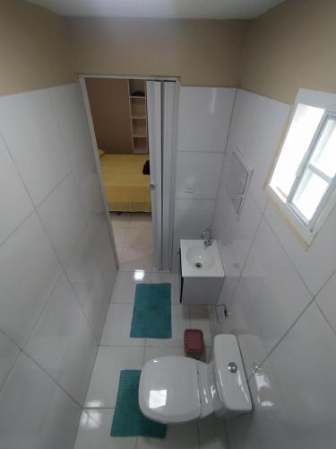 a small bathroom with a sink and a toilet at Container LB PONU in Boa Vista