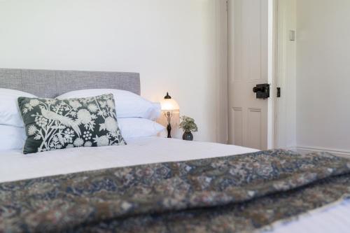 a bedroom with a bed with a pillow on it at The Governess in Launceston