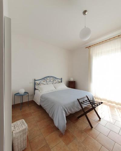 Ένα ή περισσότερα κρεβάτια σε δωμάτιο στο Albergo Diffuso La Piana dei Mulini