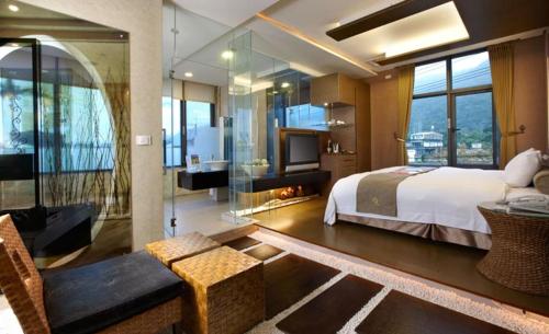 En eller flere senger på et rom på Hofi Villa
