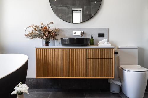 a bathroom with a sink and a mirror at The Governess in Launceston