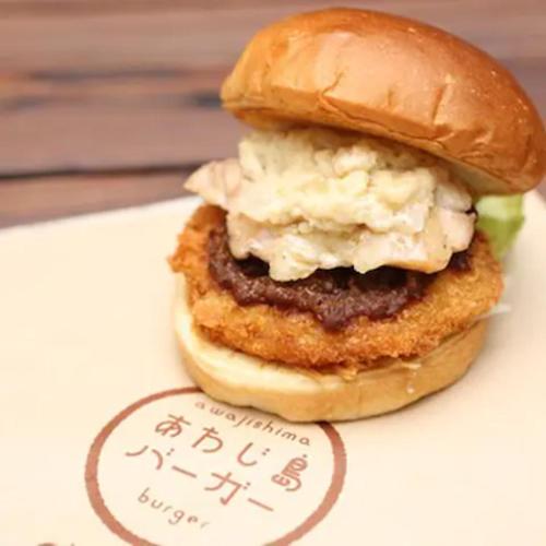 a chicken sandwich on a bun on a menu at Awaji egaosakuie in Sumoto in Sumoto