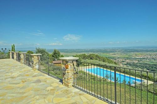 a view of a swimming pool from a house at Agriturismo Cima alla Serra in Buti