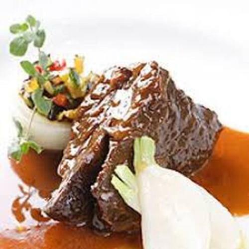a piece of chocolate cake with a salad on top at Awaji Large Log house in Goshiki 2 in Sumoto
