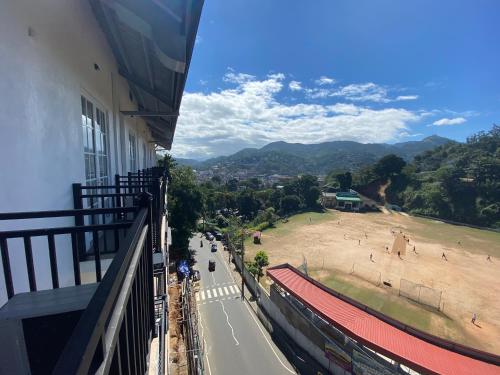 a balcony of a building with a view of a field at BPR - Asgiriya ,Kandy in Kandy