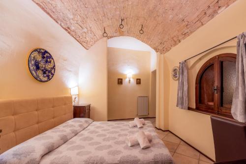 Una cama o camas en una habitación de HOTEL TREVI Palazzo Natalini