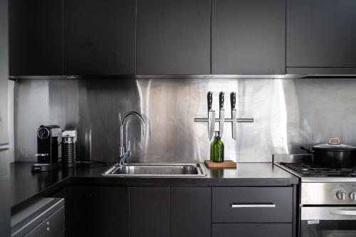 a kitchen with a sink and a stove at The Governess in Launceston