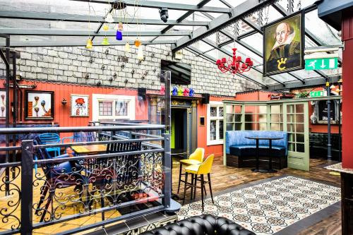 a room with a balcony with a table and chairs at Crown Quarter in Wexford