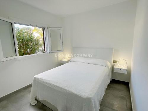 A bed or beds in a room at Villa de Amigos