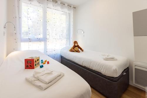 Ένα ή περισσότερα κρεβάτια σε δωμάτιο στο Camping des Gayeulles