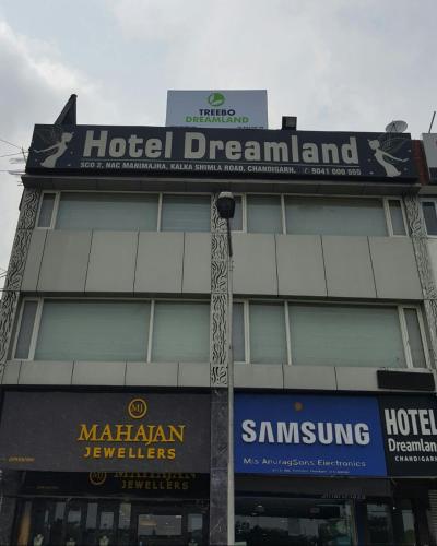 a hotel dreamland sign on top of a building at Hotel Dreamland Chandigarh in Chandīgarh