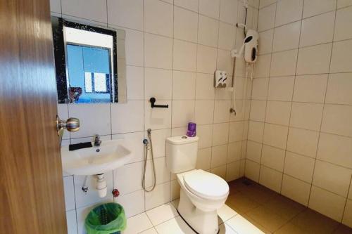 a bathroom with a toilet and a sink at myRumah Imperio Home , Alor Setar 3BR with Sky Infinity Pool in Alor Setar