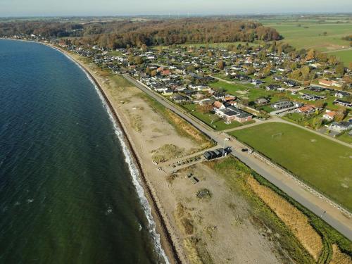 an aerial view of a town next to the ocean at Pinnebergheim in Haderslev
