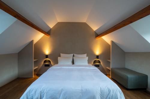 Llit o llits en una habitació de Charming House in Le Sablon