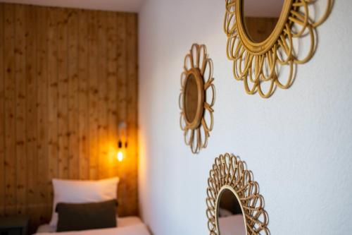 a bedroom with a bed and a mirror on the wall at Chalet La Chenevière in Nendaz